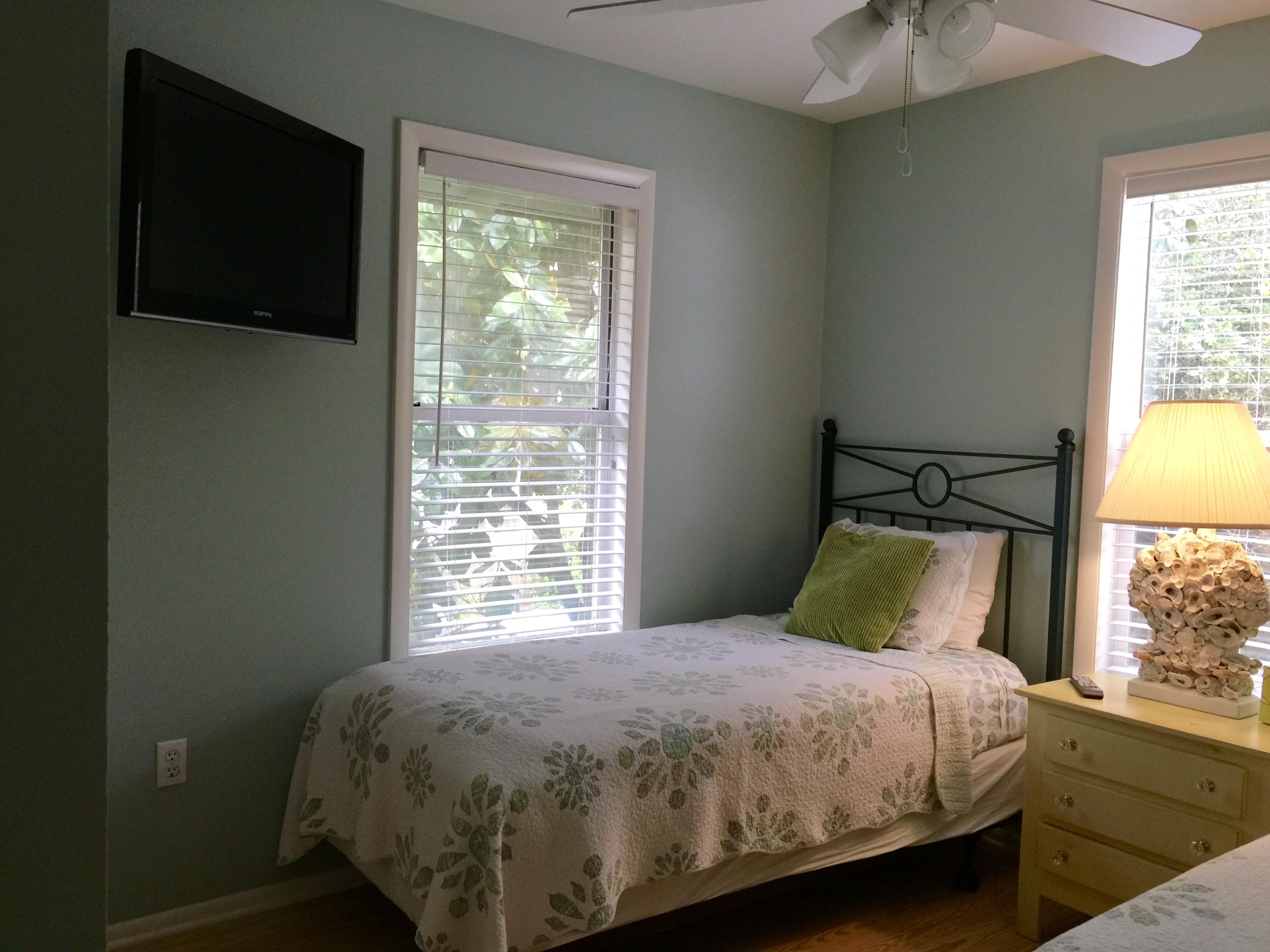 169 Magnolia Street Santa Rosa Beach, FL 32459 - Photo 14 of 18 a bed sitting in a bedroom next to a window