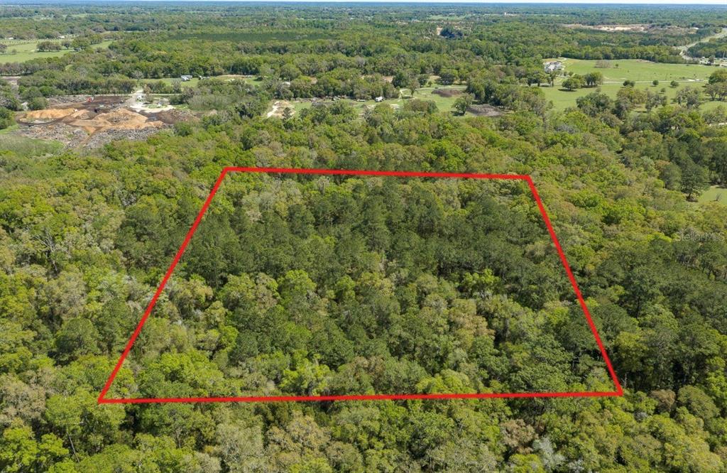 Northwest 38th Avenue Road Ocala, FL 34482 - Photo 1 of 2 an aerial view of residential houses with outdoor space and trees