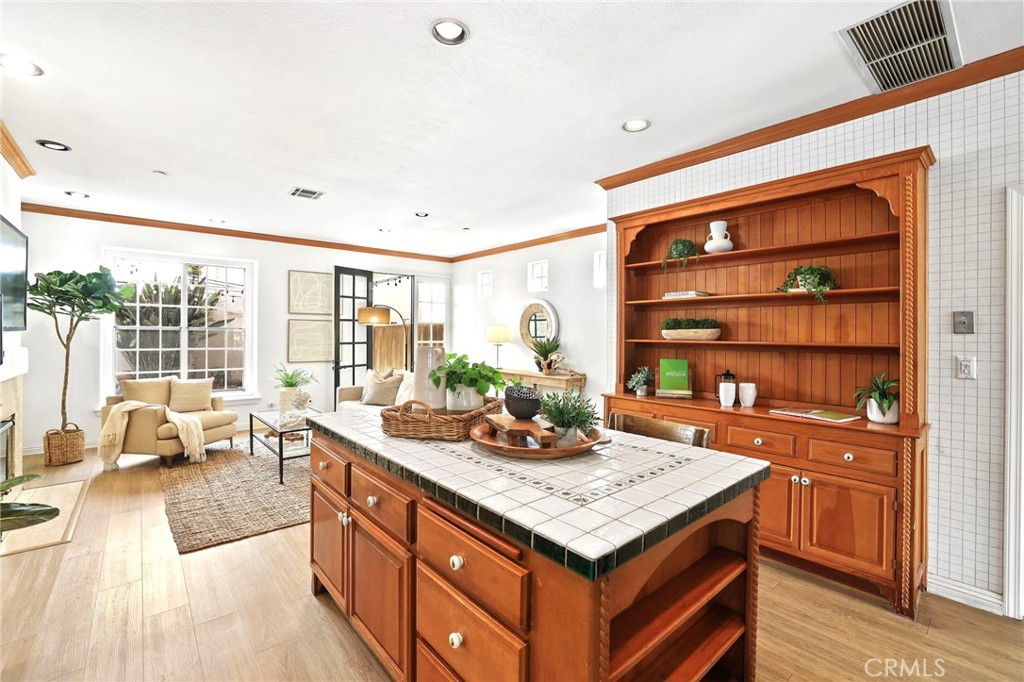 247 6th Street Seal Beach, CA 90740 - Photo 13 of 39 a kitchen with a sink stove and cabinets