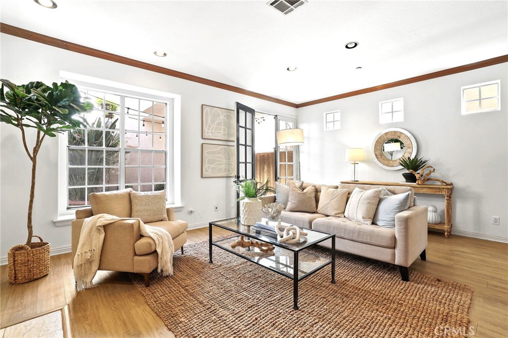 247 6th Street Seal Beach, CA 90740 - Photo 16 of 39 a living room with furniture and a large window