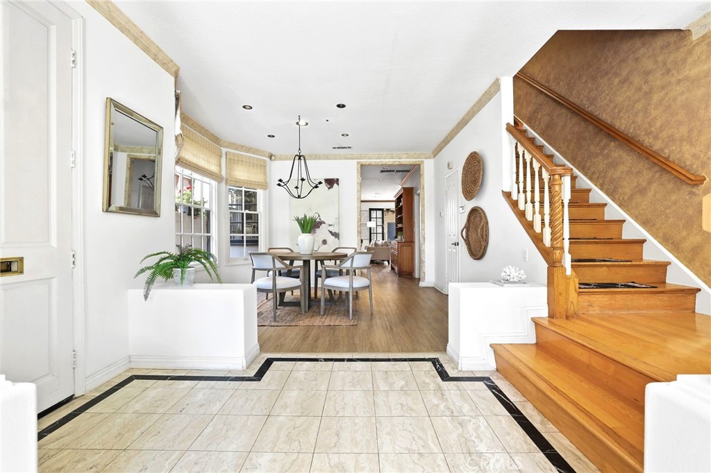 247 6th Street Seal Beach, CA 90740 - Photo 17 of 39 a view of dining room with furniture and floor to ceiling window