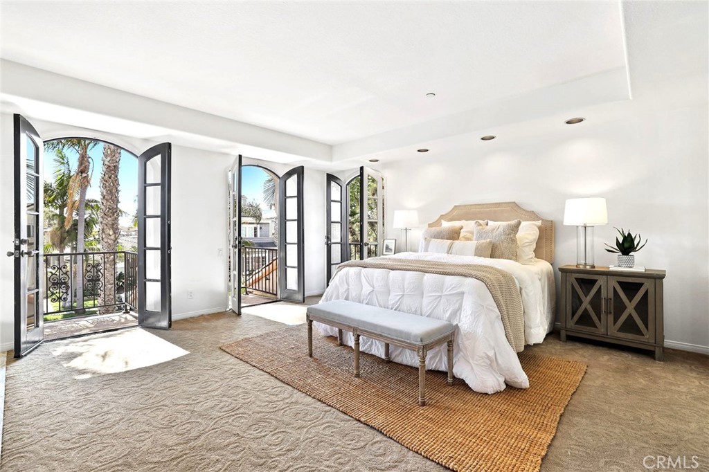 247 6th Street Seal Beach, CA 90740 - Photo 20 of 39 a bedroom with a bed and large window