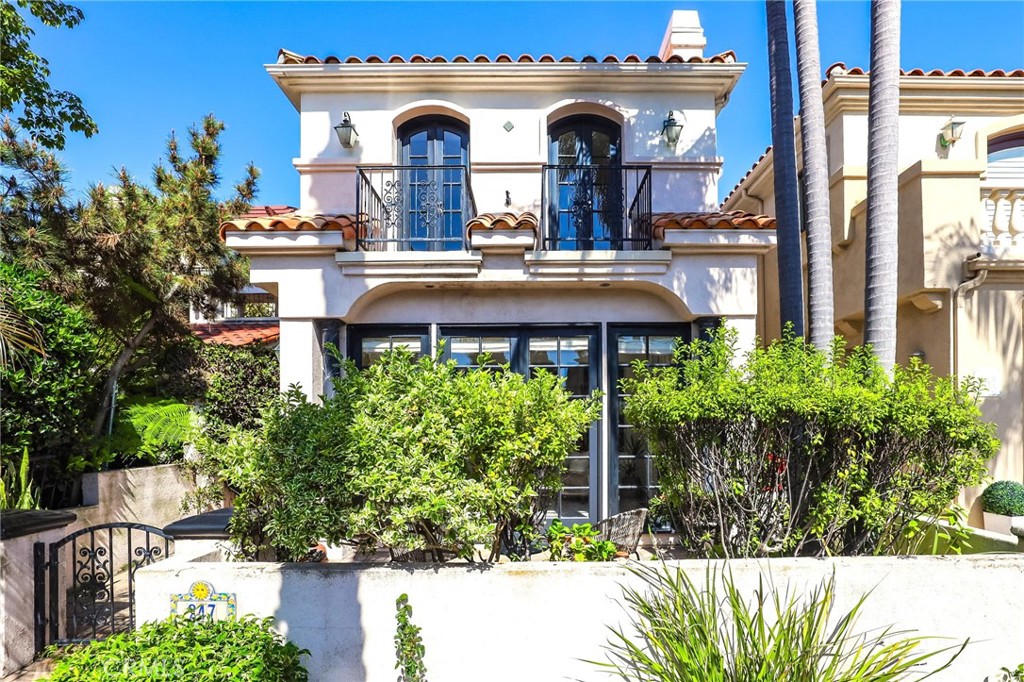 247 6th Street Seal Beach, CA 90740 - Photo 2 of 39 a view of a building with a garden