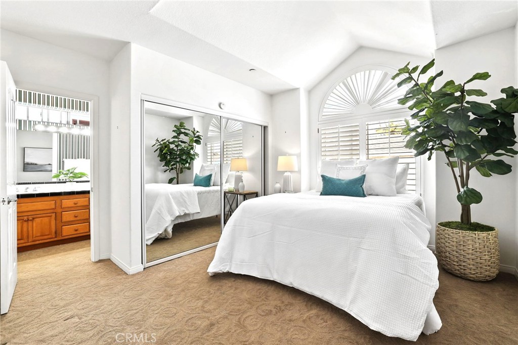 247 6th Street Seal Beach, CA 90740 - Photo 33 of 39 a bedroom with a bed and a couch