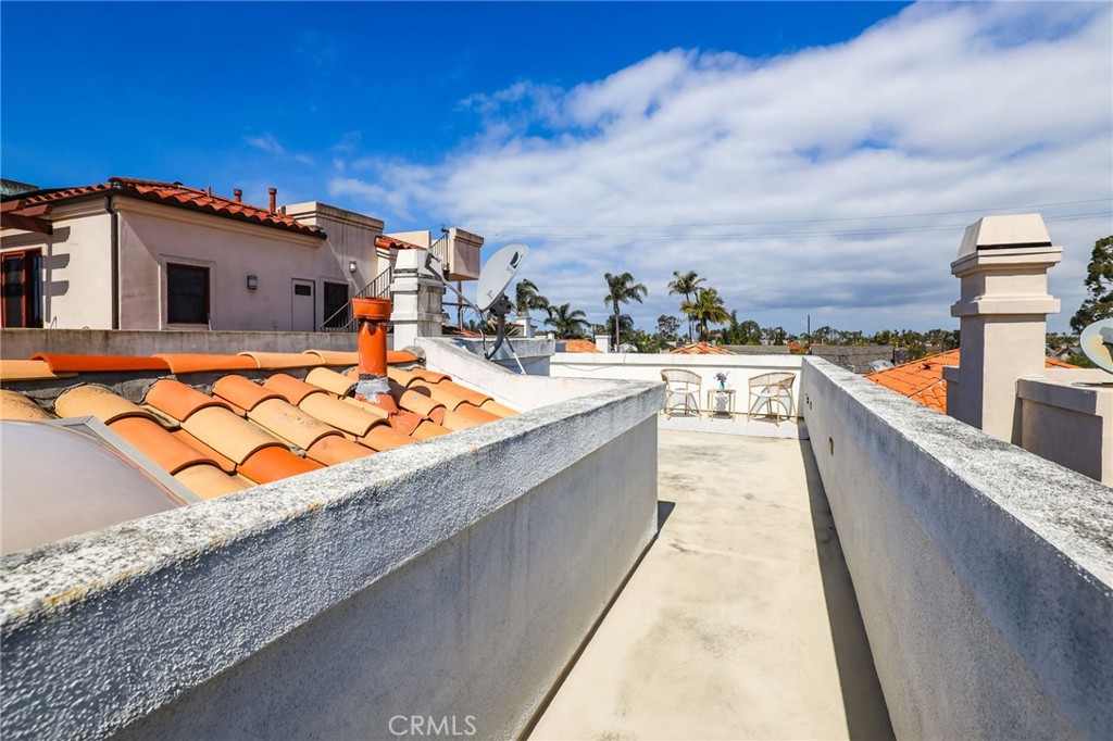 247 6th Street Seal Beach, CA 90740 - Photo 35 of 39 a balcony with an ocean view
