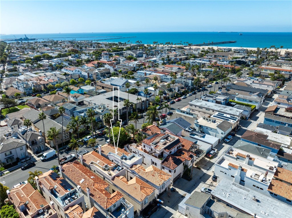247 6th Street Seal Beach, CA 90740 - Photo 39 of 39 an aerial view of a city with lots of residential buildings and ocean view in back