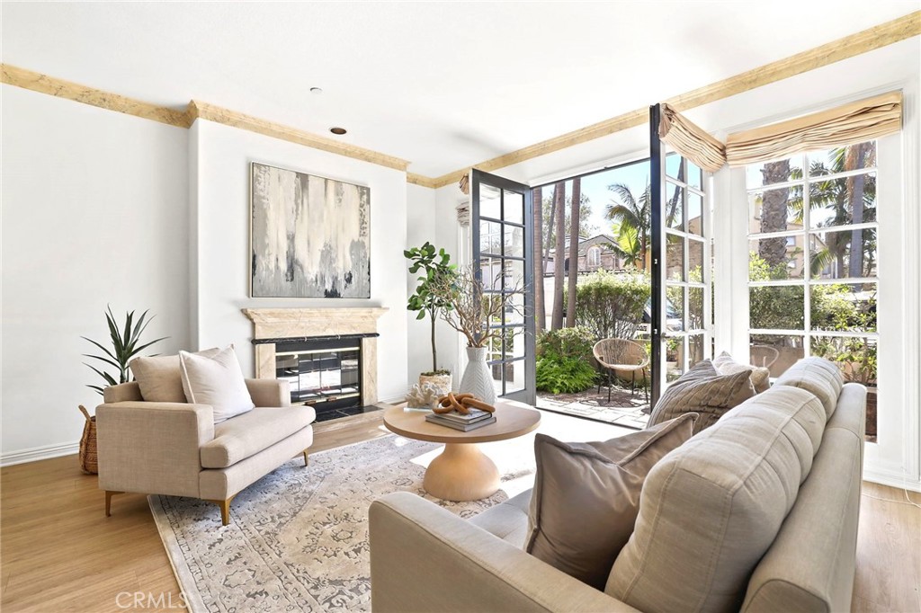 247 6th Street Seal Beach, CA 90740 - Photo 5 of 39 a living room with furniture and a fireplace