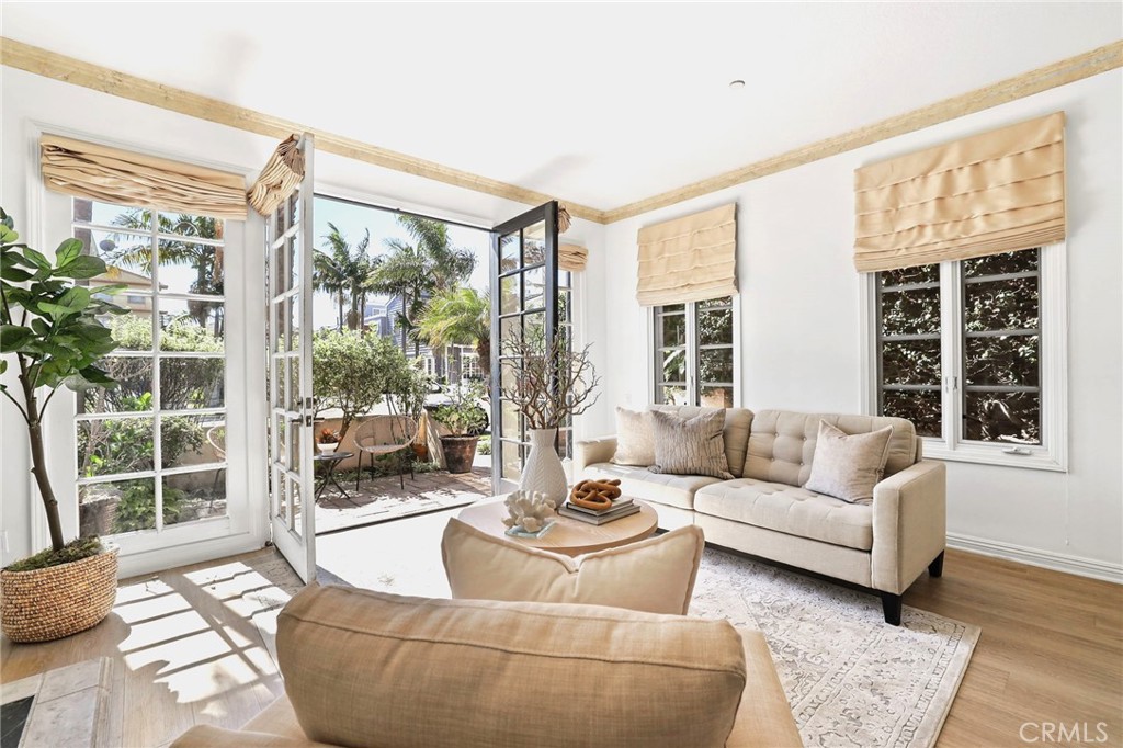 247 6th Street Seal Beach, CA 90740 - Photo 6 of 39 a living room with furniture and a large window