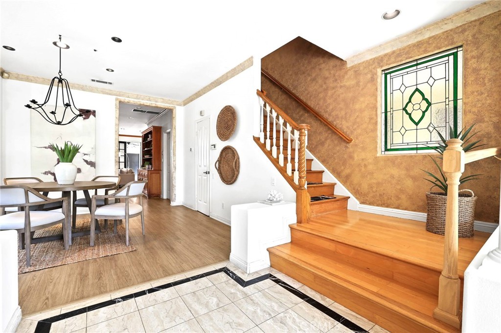 247 6th Street Seal Beach, CA 90740 - Photo 9 of 39 a view of entryway and dining room with furniture