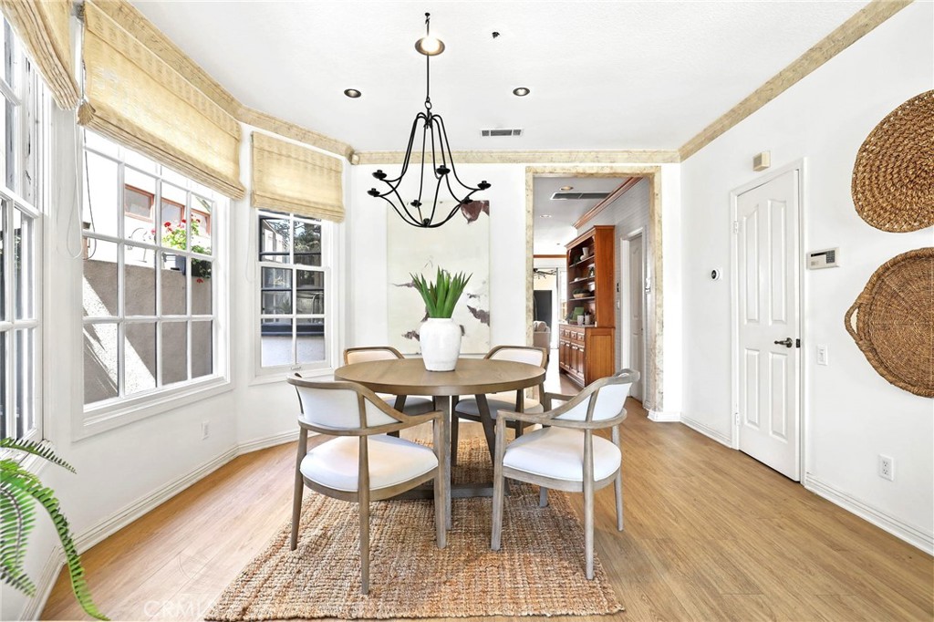 247 6th Street Seal Beach, CA 90740 - Photo 10 of 39 a view of a dining room with furniture window and wooden floor