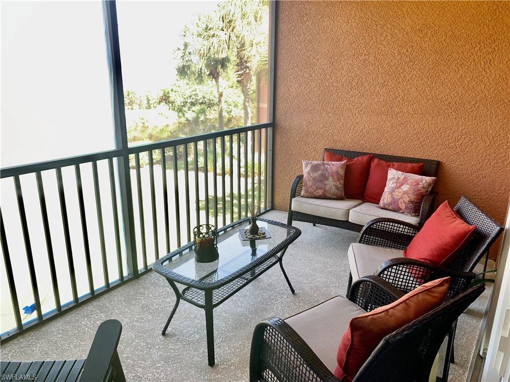 10045 Heather Lane, Unit 2203 Naples, FL 34119 - Photo 11 of 23 a view of a livingroom with furniture and wooden floor