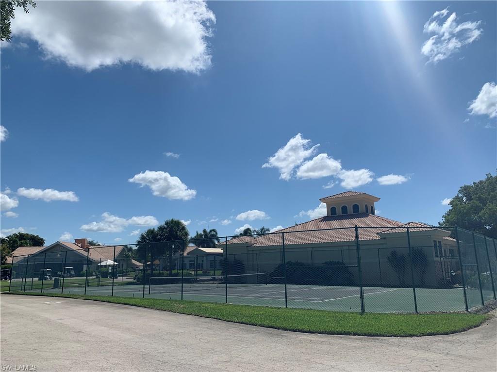 10045 Heather Lane, Unit 2203 Naples, FL 34119 - Photo 17 of 23 a view of a yard in front of a building