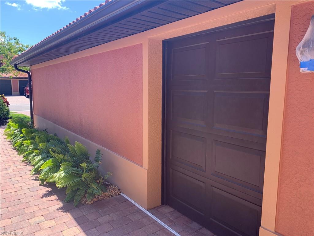 10045 Heather Lane, Unit 2203 Naples, FL 34119 - Photo 21 of 23 a backyard with potted plants
