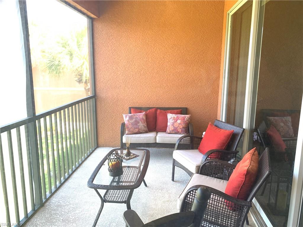 10045 Heather Lane, Unit 2203 Naples, FL 34119 - Photo 10 of 23 a living room with furniture and a window