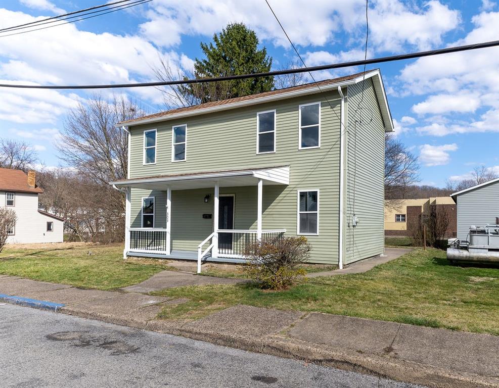 303 Henon Avenue Rochester, PA 15074 - Photo 3 of 33 a view of a house with a yard and plants