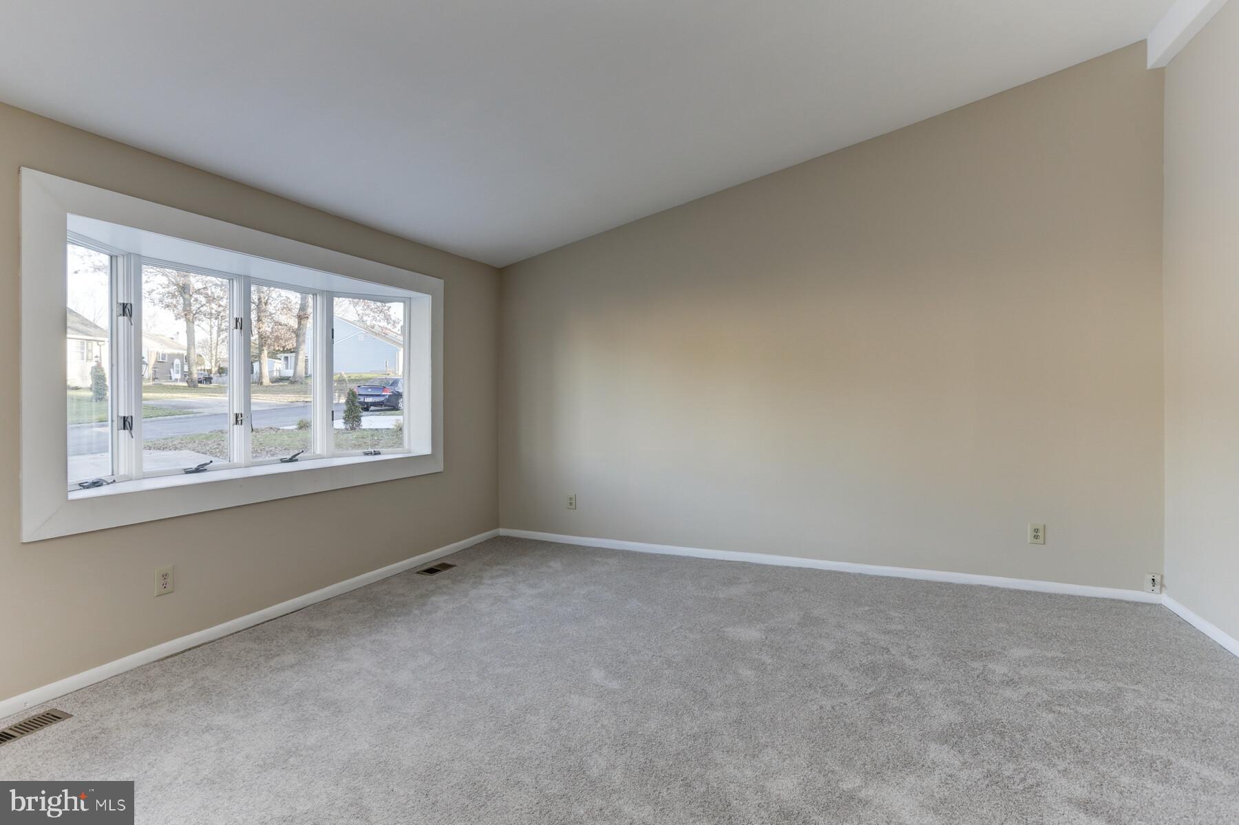 5404 Balistan Road Baltimore, MD 21237 - Photo 3 of 25 Living Room w/ fresh paint and new carpet