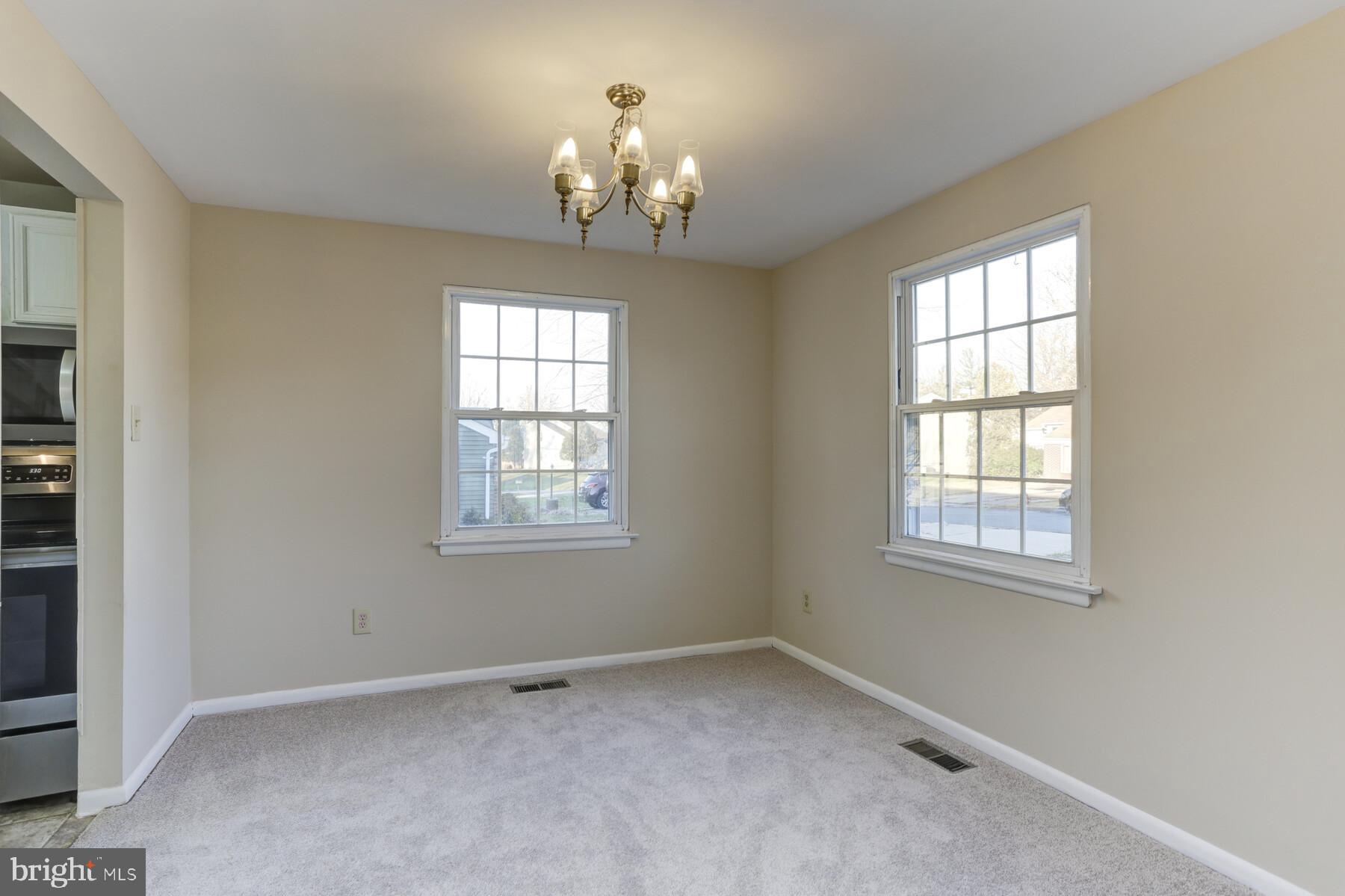5404 Balistan Road Baltimore, MD 21237 - Photo 5 of 25 Dining Room w/ fresh paint and new carpet