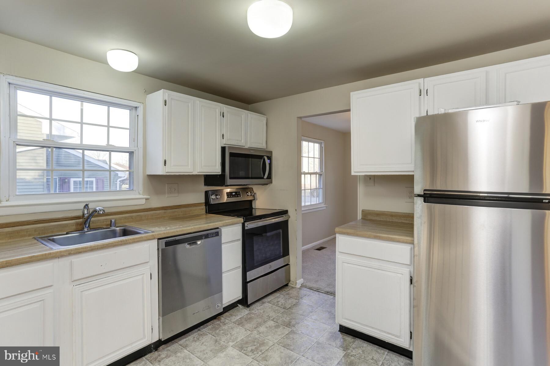 5404 Balistan Road Baltimore, MD 21237 - Photo 7 of 25 Kitchen w/ new appliances and flooring