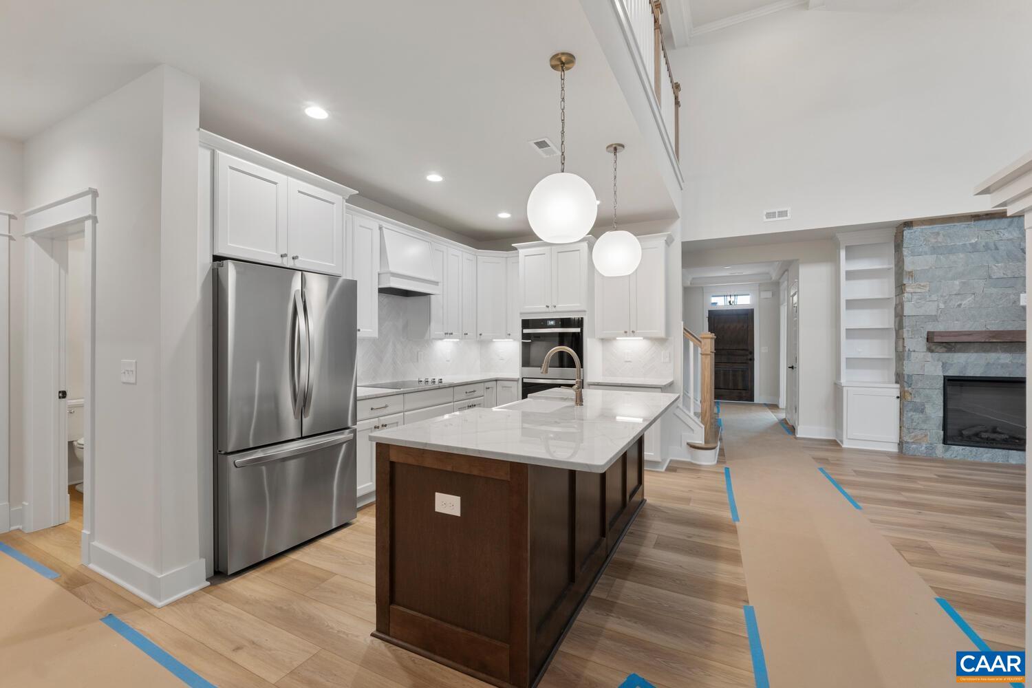 935 Addle Hill Road Crozet, VA 22932 - Photo 19 of 56 a kitchen with stainless steel appliances granite countertop a sink a refrigerator and a stove