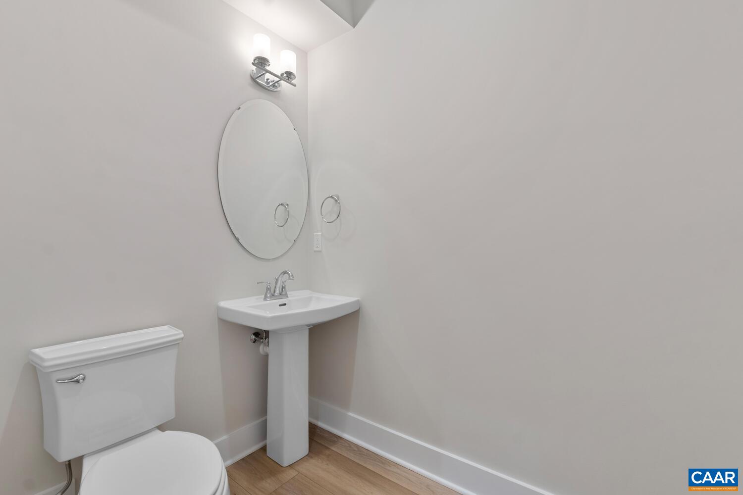 935 Addle Hill Road Crozet, VA 22932 - Photo 34 of 56 a bathroom with a toilet a sink and mirror