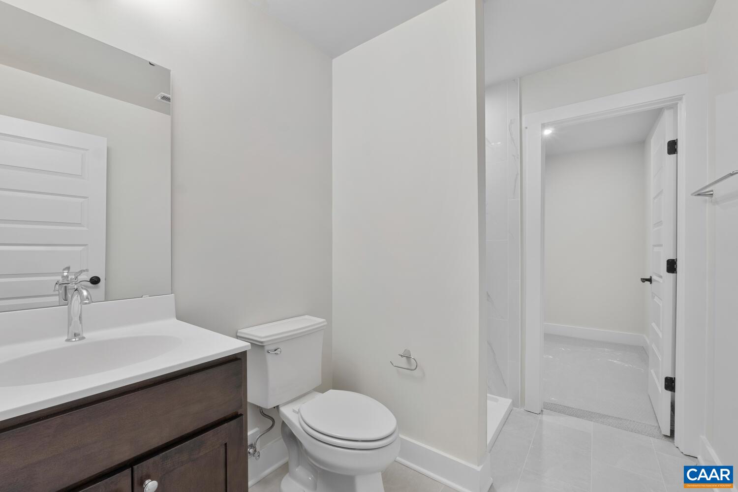 935 Addle Hill Road Crozet, VA 22932 - Photo 42 of 56 a bathroom with a sink a toilet and shower