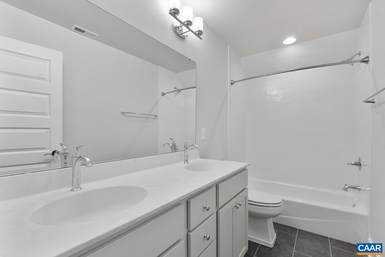 935 Addle Hill Road Crozet, VA 22932 - Photo 45 of 56 a bathroom with a sink toilet a shower and a mirror