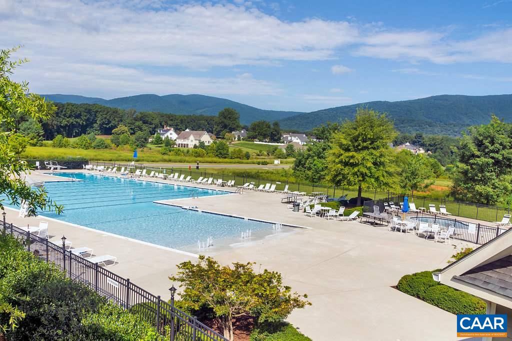 935 Addle Hill Road Crozet, VA 22932 - Photo 51 of 56 an aerial view of a house with a garden and lake view