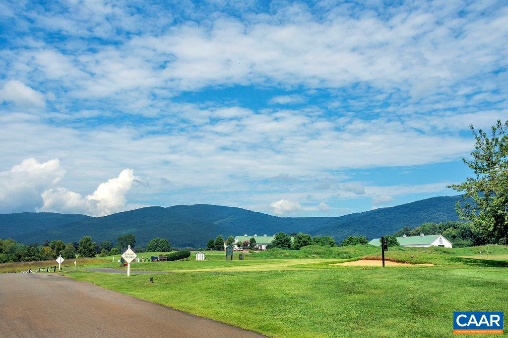 935 Addle Hill Road Crozet, VA 22932 - Photo 53 of 56 a view of a big yard with an empty house and wooden deck