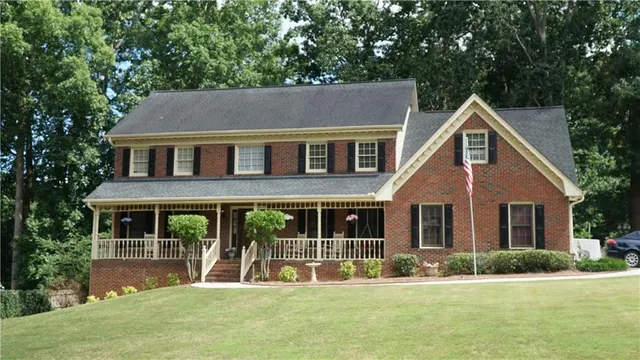 a view of two chairs in the balcony