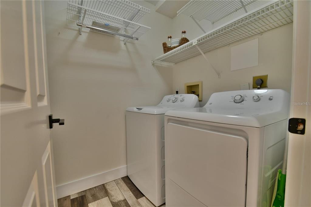 1801 East Lake Road South, Unit 15E Palm Harbor, FL 34685 - Photo 19 of 24 a utility room with dryer and washer