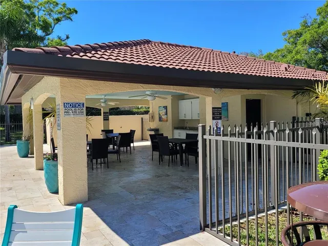a view of a chairs and table in the patio