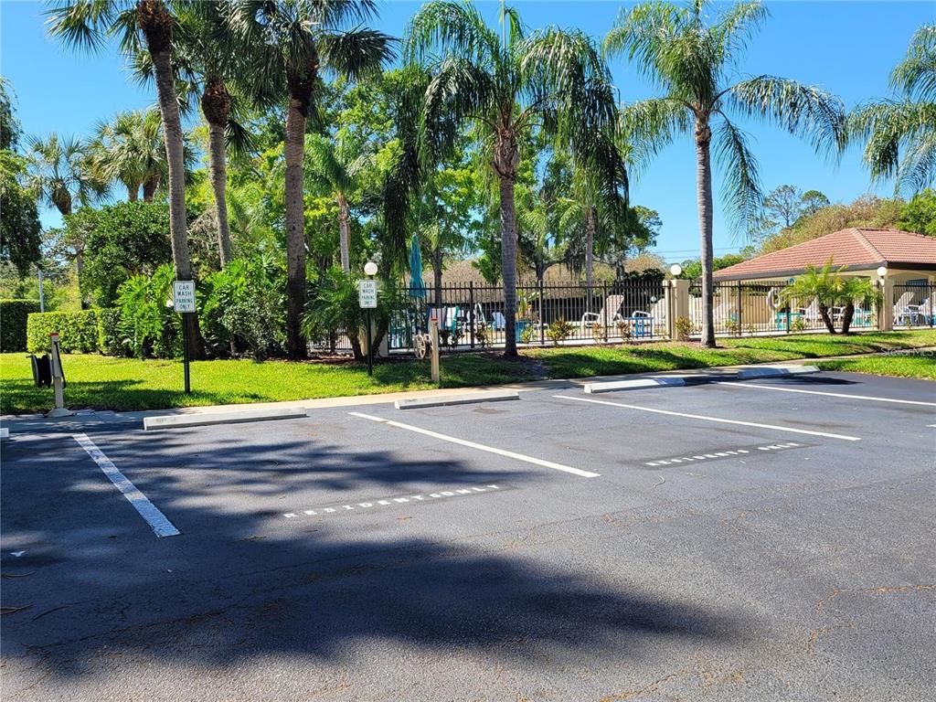1801 East Lake Road South, Unit 15E Palm Harbor, FL 34685 - Photo 23 of 24 a view of street with houses and trees