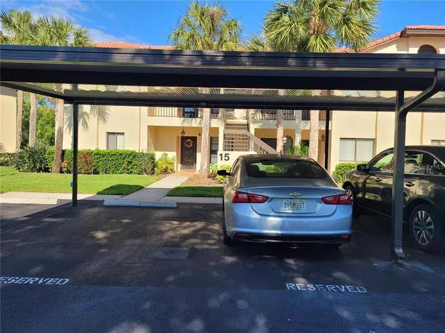a living room with couch and chairs
