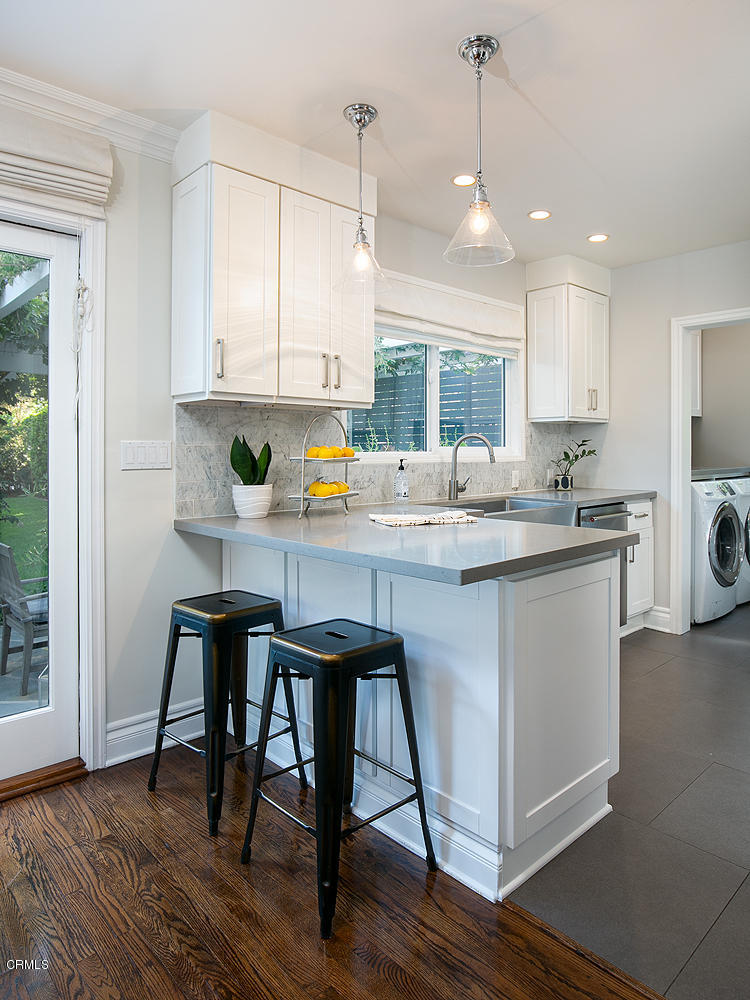 2286 Galbreth Road Pasadena, CA 91104 - Photo 11 of 25 a kitchen with a table chairs cabinets and wooden floor