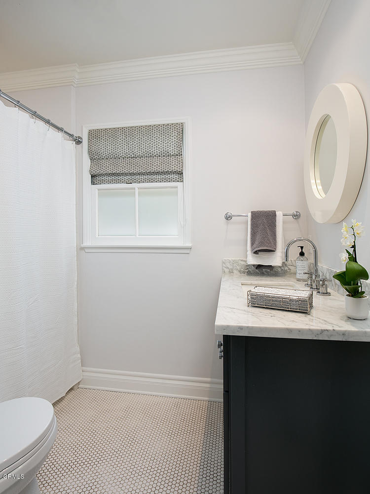 2286 Galbreth Road Pasadena, CA 91104 - Photo 19 of 25 a bathroom with a sink toilet a mirror and vanity