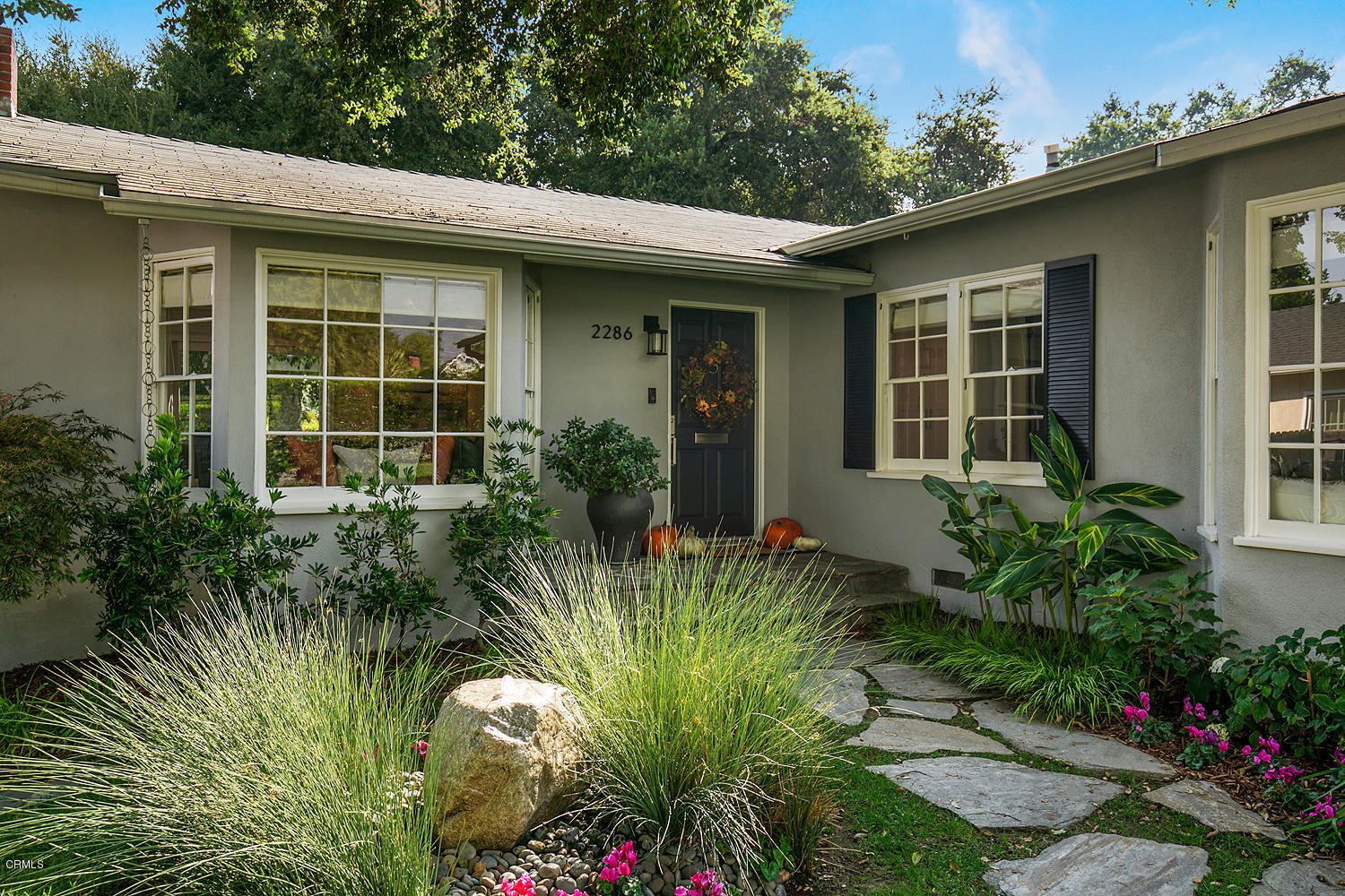 2286 Galbreth Road Pasadena, CA 91104 - Photo 3 of 25 a front view of a house with a garden