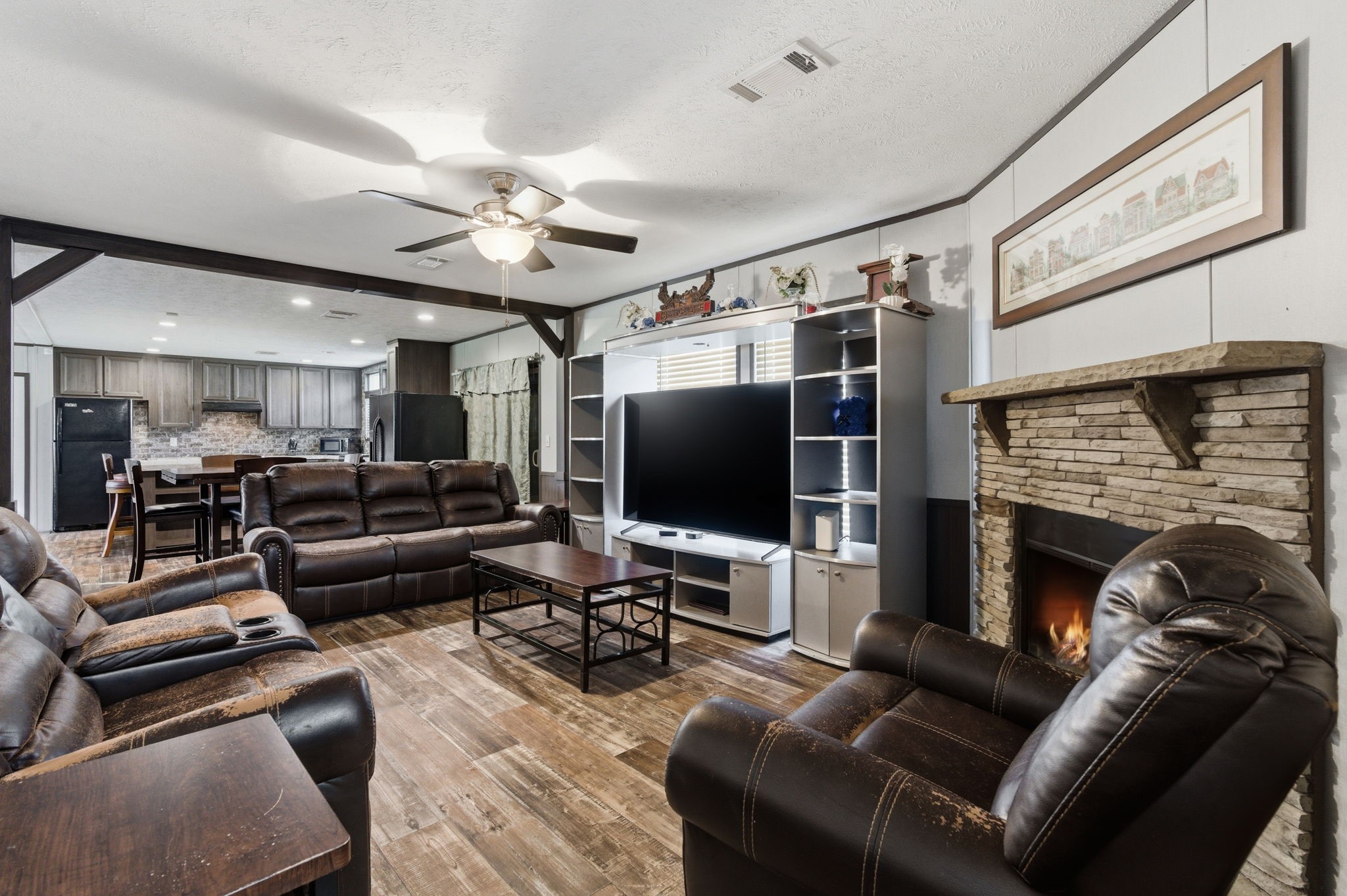 3110 Green Forest Road Conroe, TX 77303 - Photo 11 of 50 a living room with furniture and a flat screen tv