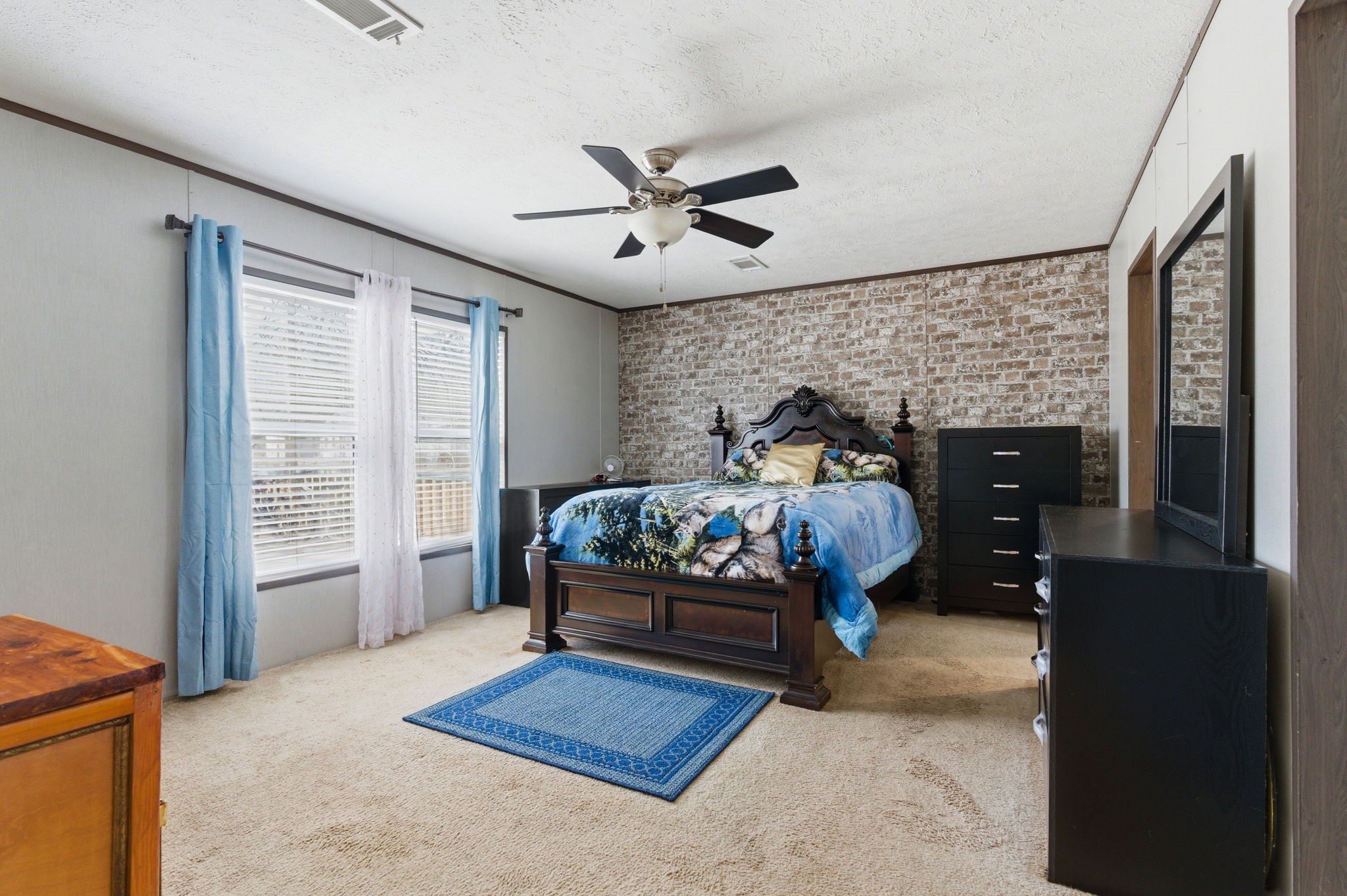 3110 Green Forest Road Conroe, TX 77303 - Photo 12 of 50 a bedroom with a bed window and a dresser