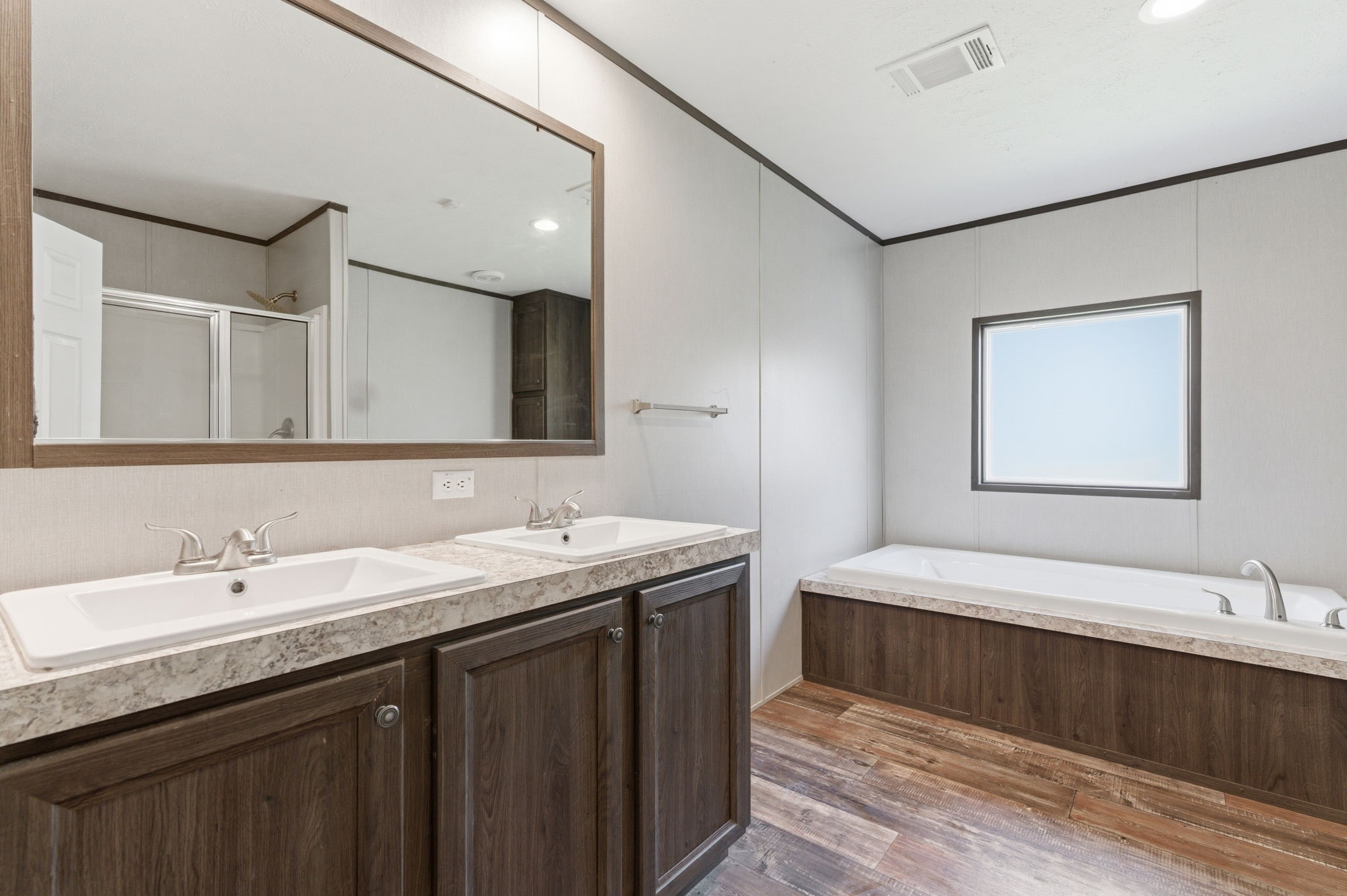 3110 Green Forest Road Conroe, TX 77303 - Photo 13 of 50 a bathroom with a double vanity sink and a mirror