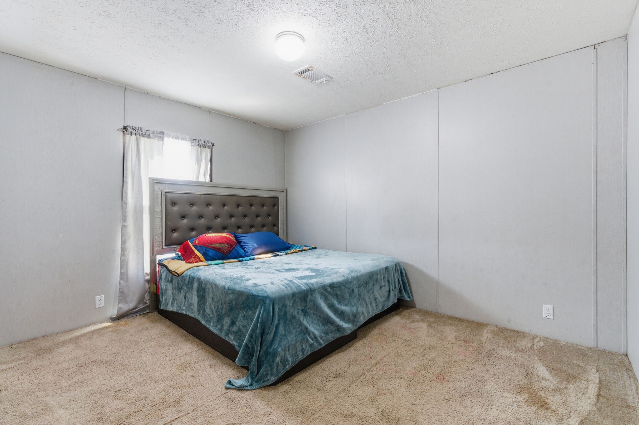 3110 Green Forest Road Conroe, TX 77303 - Photo 20 of 50 a bedroom with a bed and a window in it