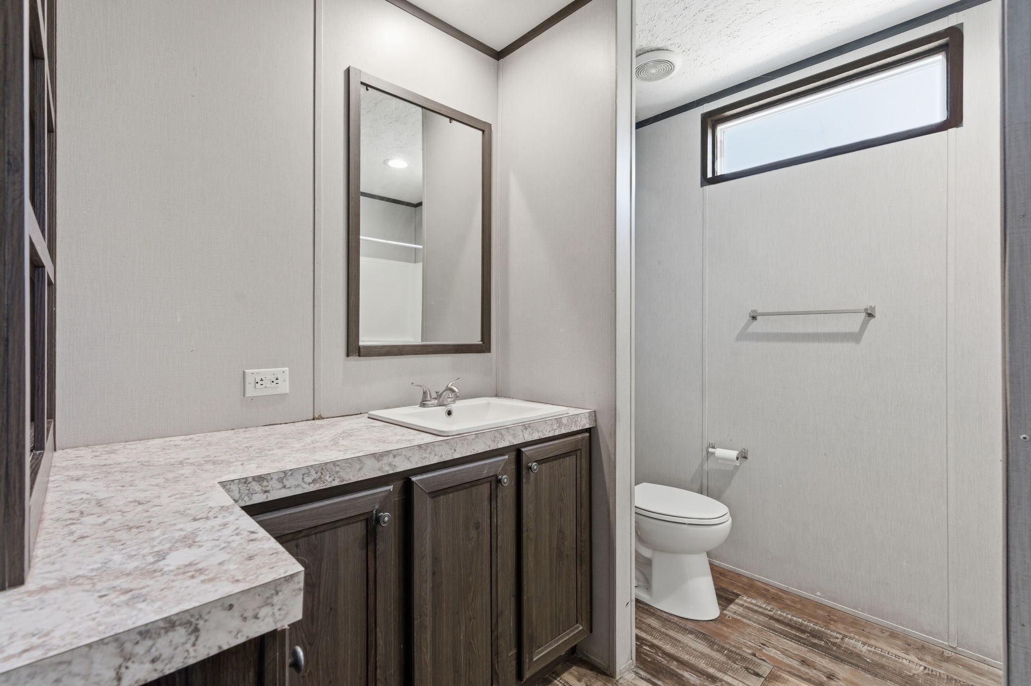 3110 Green Forest Road Conroe, TX 77303 - Photo 22 of 50 a bathroom with a granite countertop sink toilet and mirror