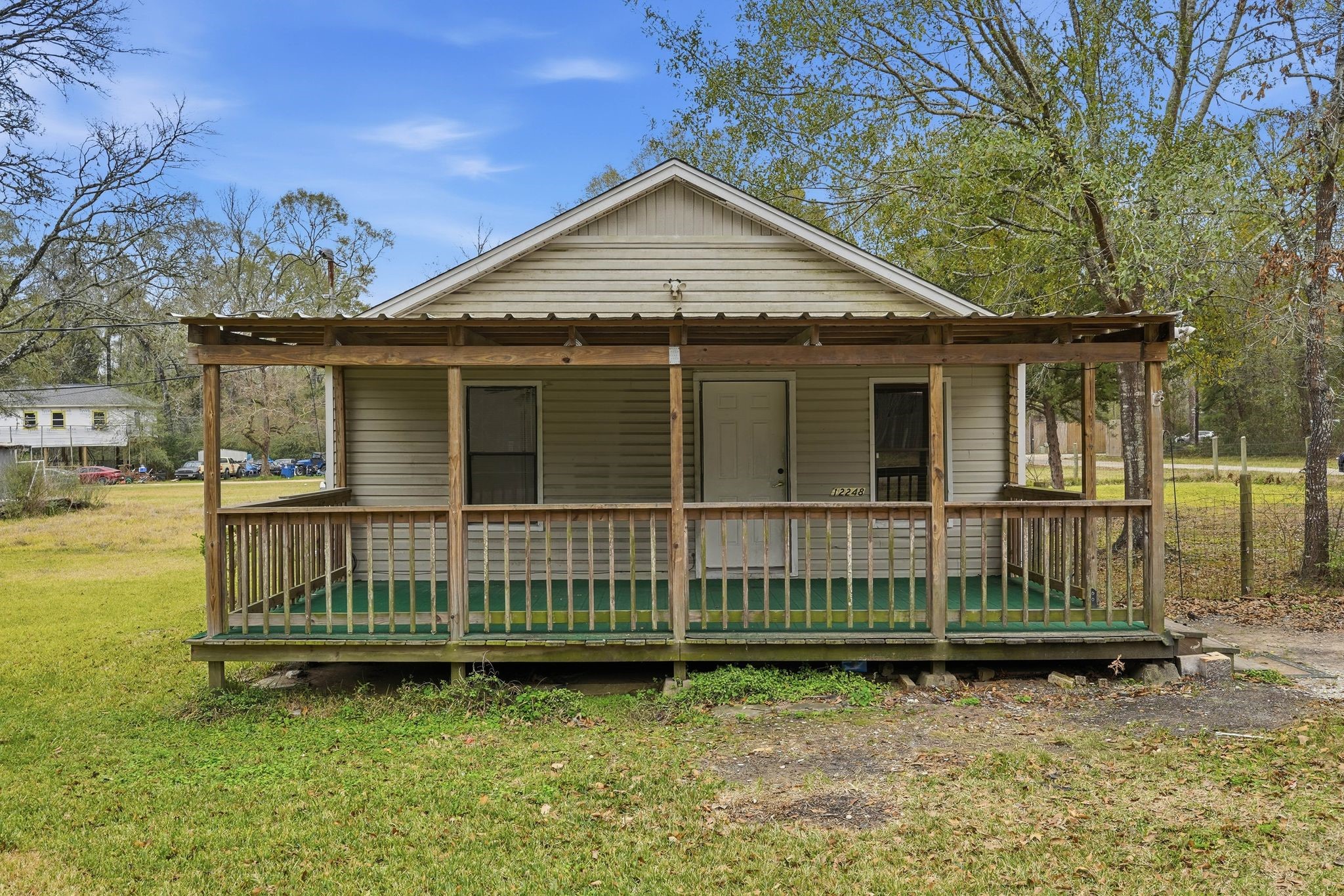 3110 Green Forest Road Conroe, TX 77303 - Photo 36 of 50 a front view of a house with a garden