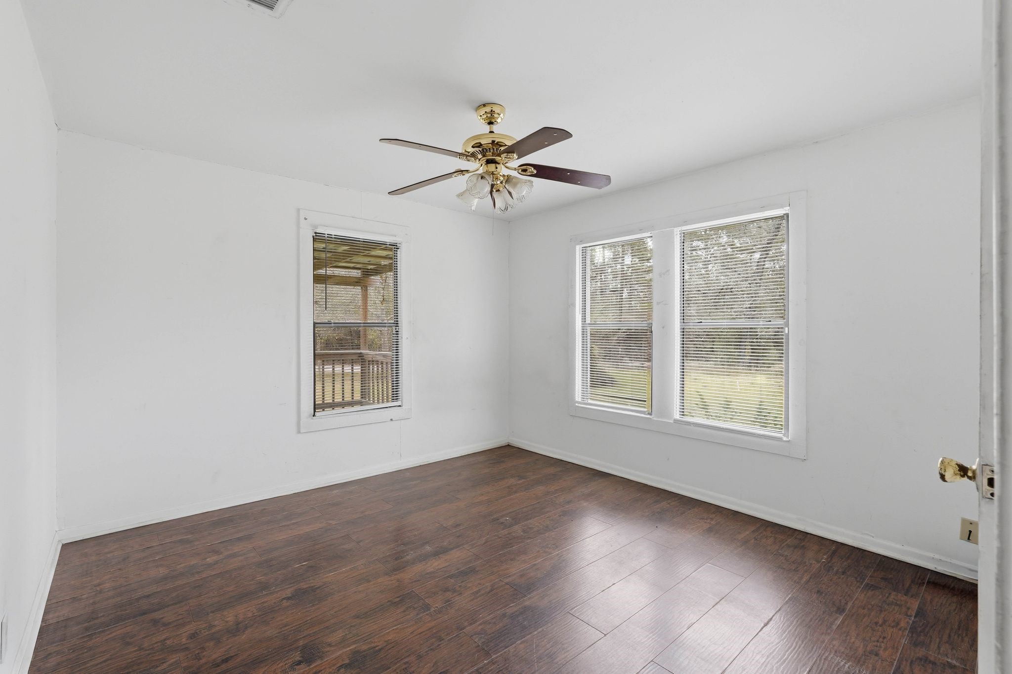 3110 Green Forest Road Conroe, TX 77303 - Photo 42 of 50 a view of a livingroom with a ceiling fan and window