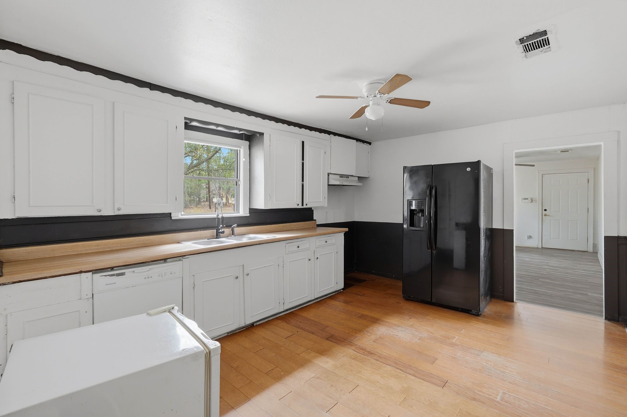 3110 Green Forest Road Conroe, TX 77303 - Photo 48 of 50 a large kitchen with a refrigerator and a sink