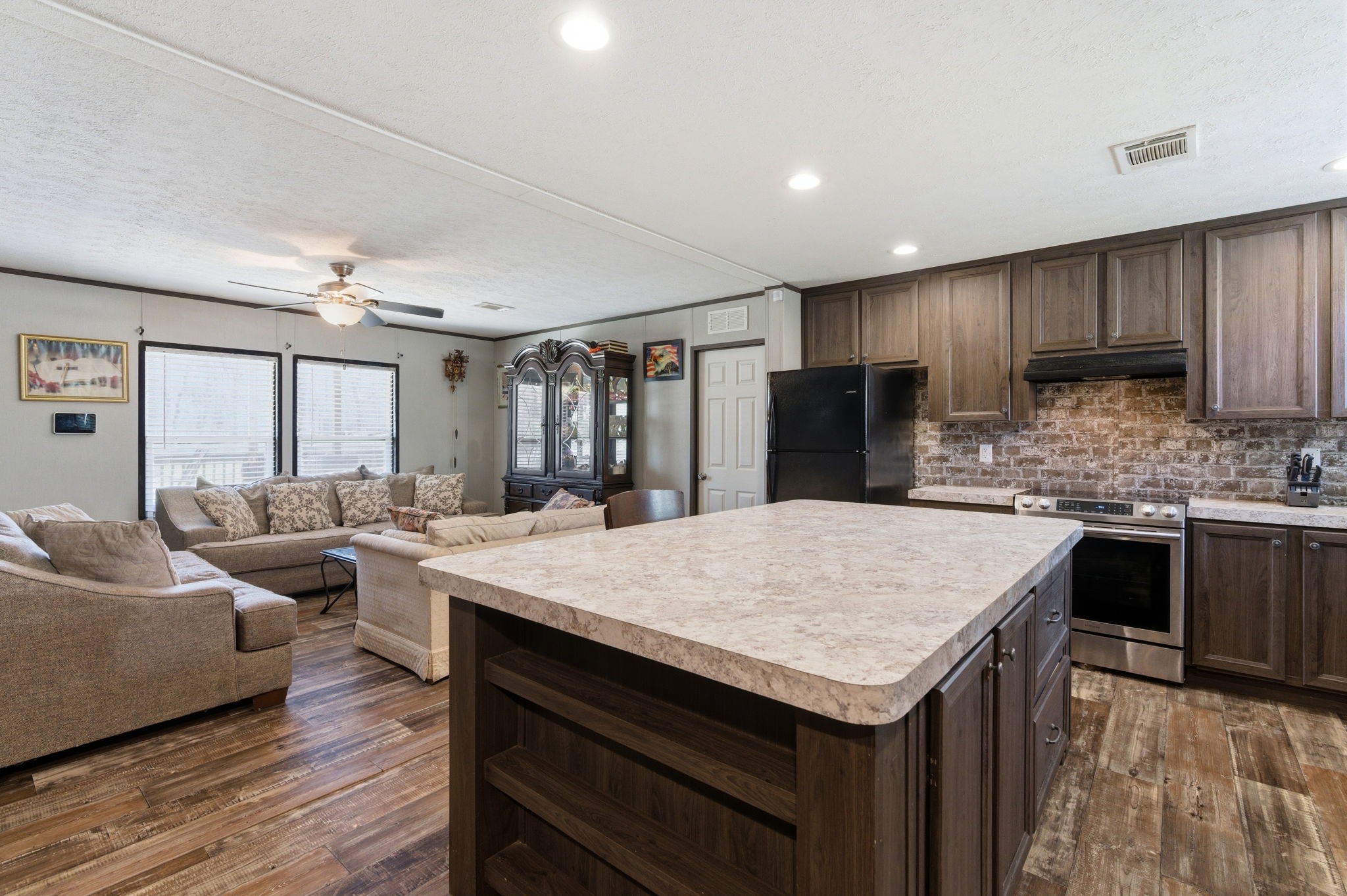 3110 Green Forest Road Conroe, TX 77303 - Photo 7 of 50 a kitchen with a stove a refrigerator and a sink
