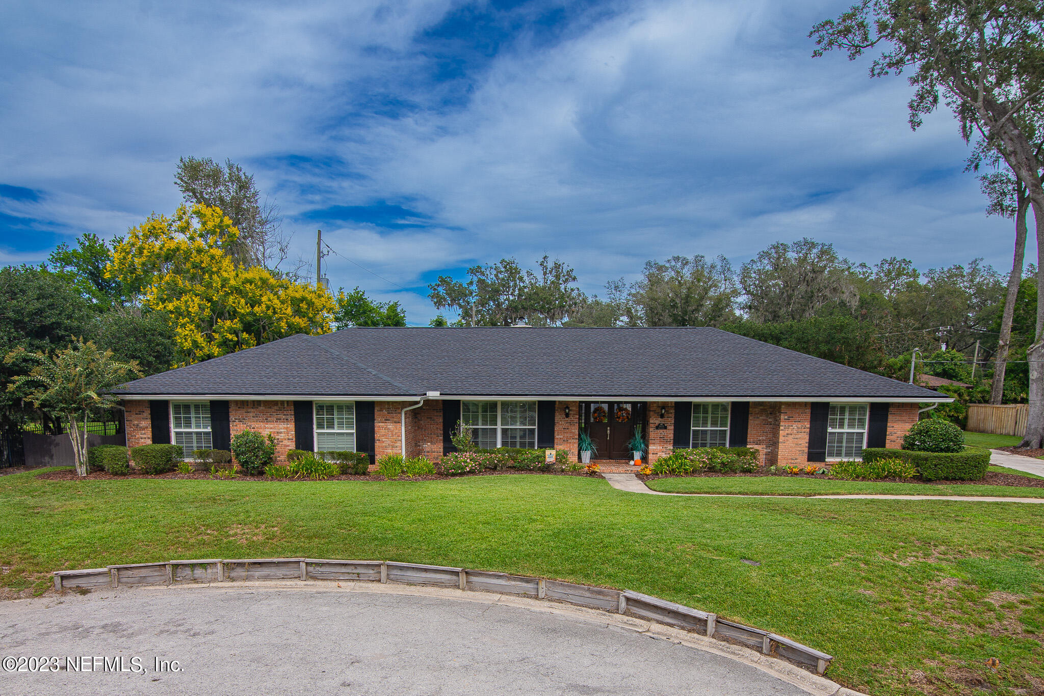 9409 Woodhaven Road Jacksonville, FL 32257 - Photo 1 of 38 a front view of a house with a yard