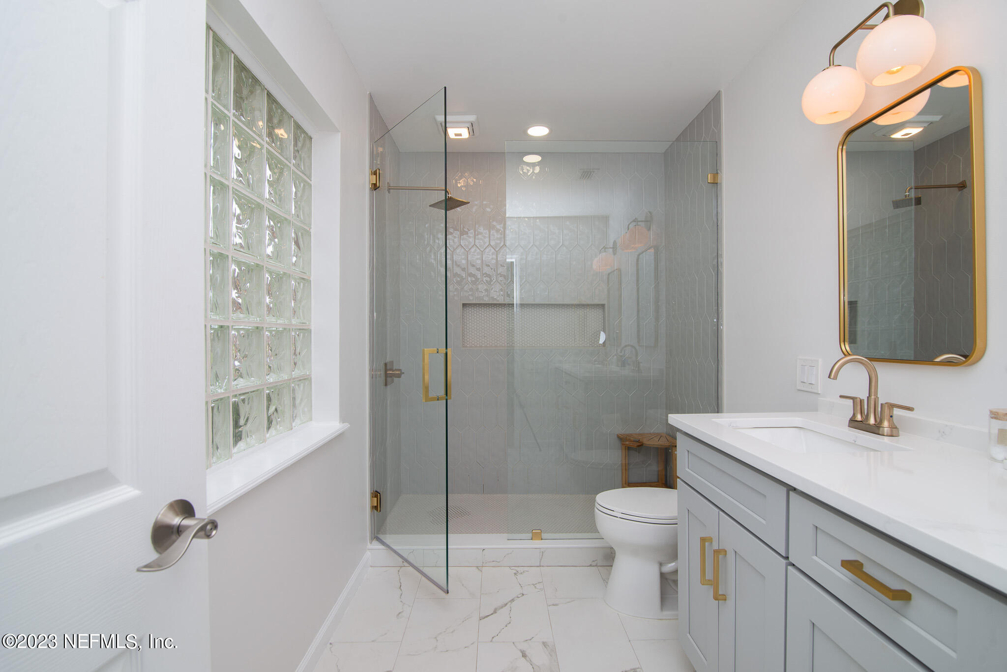 9409 Woodhaven Road Jacksonville, FL 32257 - Photo 21 of 38 a bathroom with a sink a toilet and shower