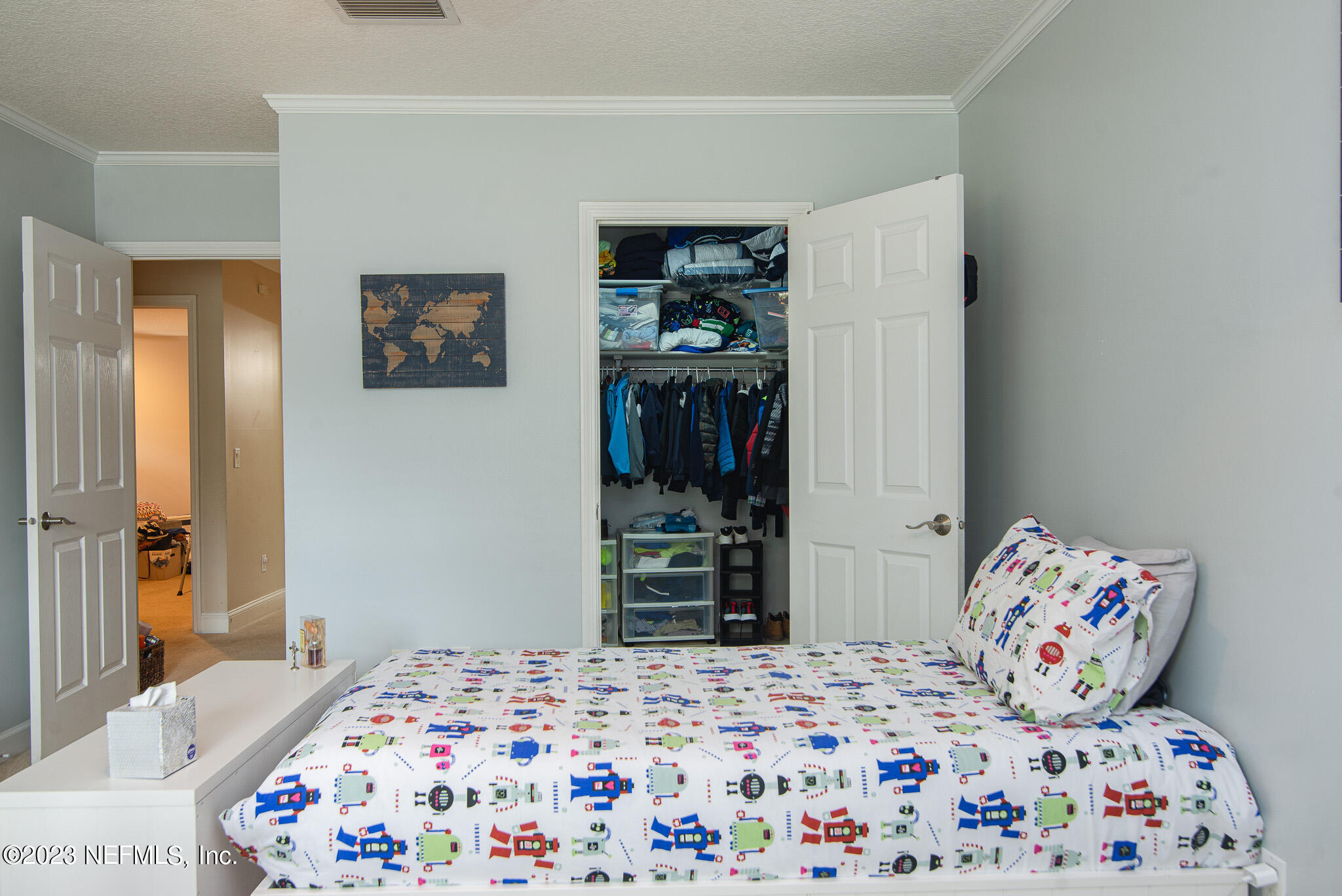 9409 Woodhaven Road Jacksonville, FL 32257 - Photo 24 of 38 a bedroom with a bed and a dresser