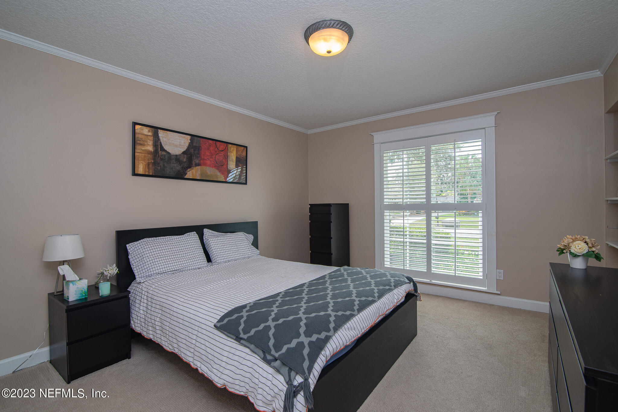9409 Woodhaven Road Jacksonville, FL 32257 - Photo 29 of 38 a bedroom with a bed and a window