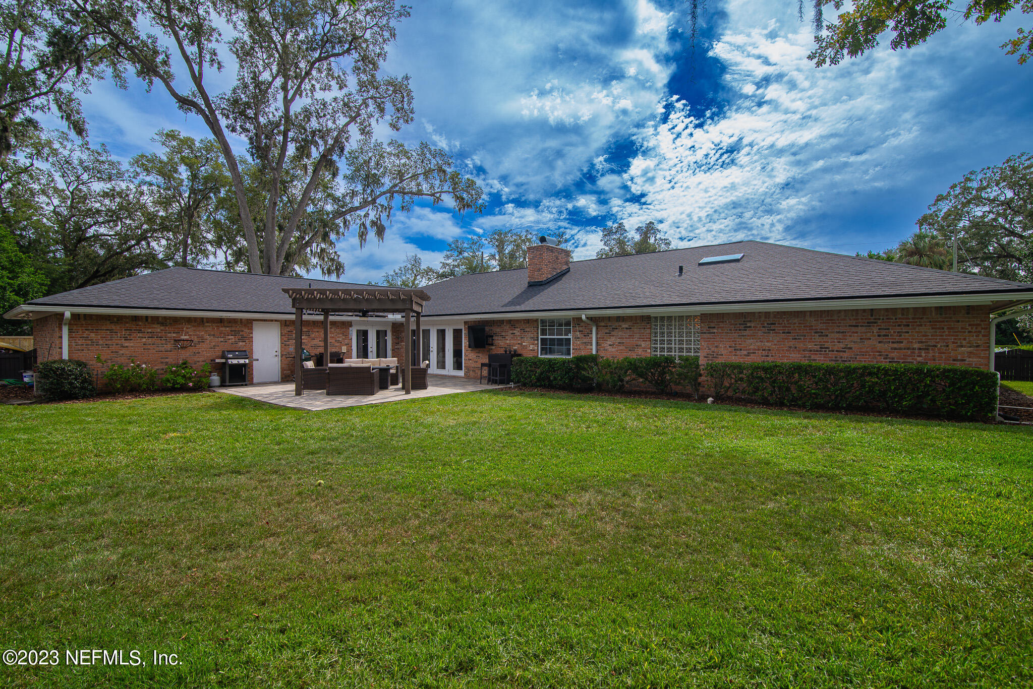 9409 Woodhaven Road Jacksonville, FL 32257 - Photo 36 of 38 a front view of a house with a garden